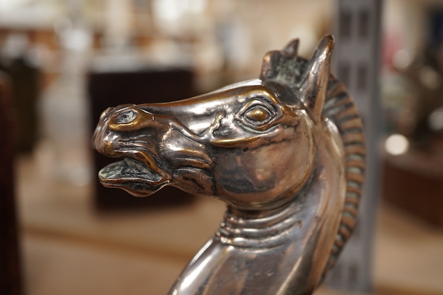 A silver plated Pegasus horse's head car mascot, signed D.G. Yeo, dated 1924, mounted on a wooden plinth